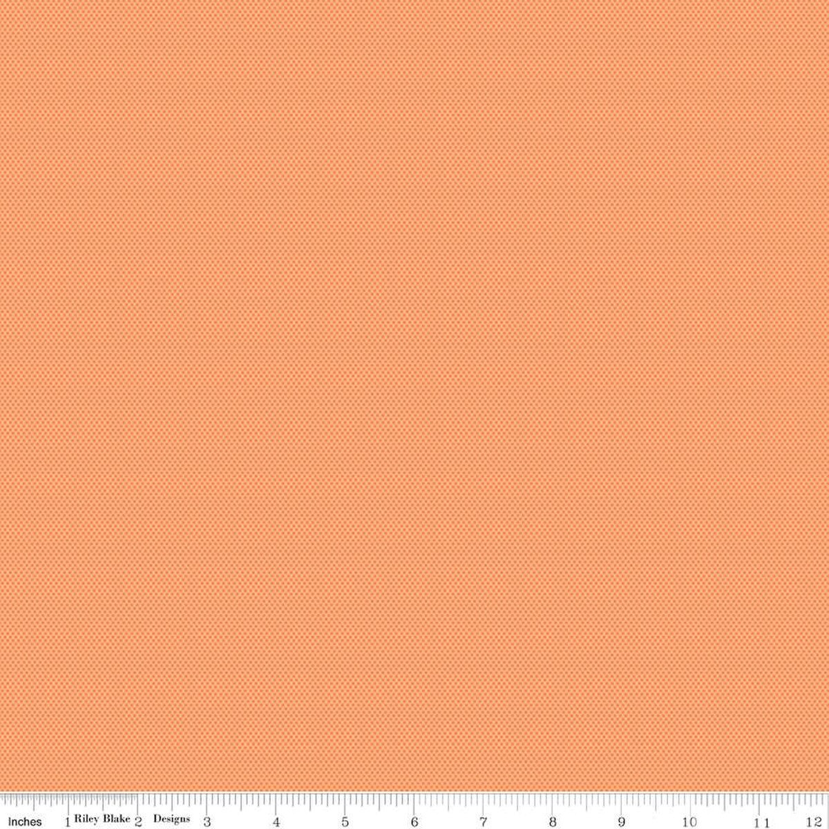 Solid peach-colored fabric texture with a ruler at the bottom for scale.