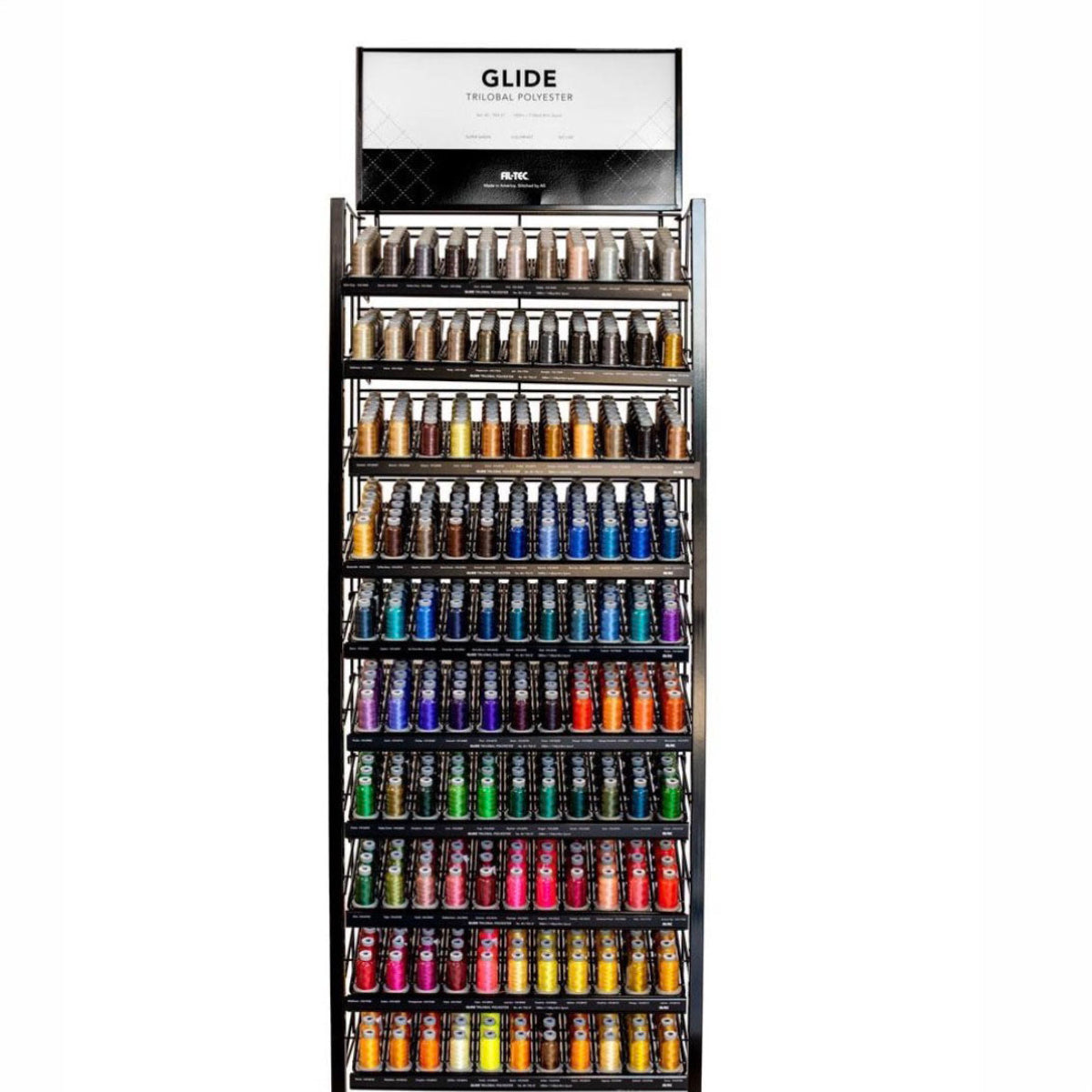 A tall black retail display rack filled with many thread spools in assorted colors, with a white sign at the top reading GLIDE.
