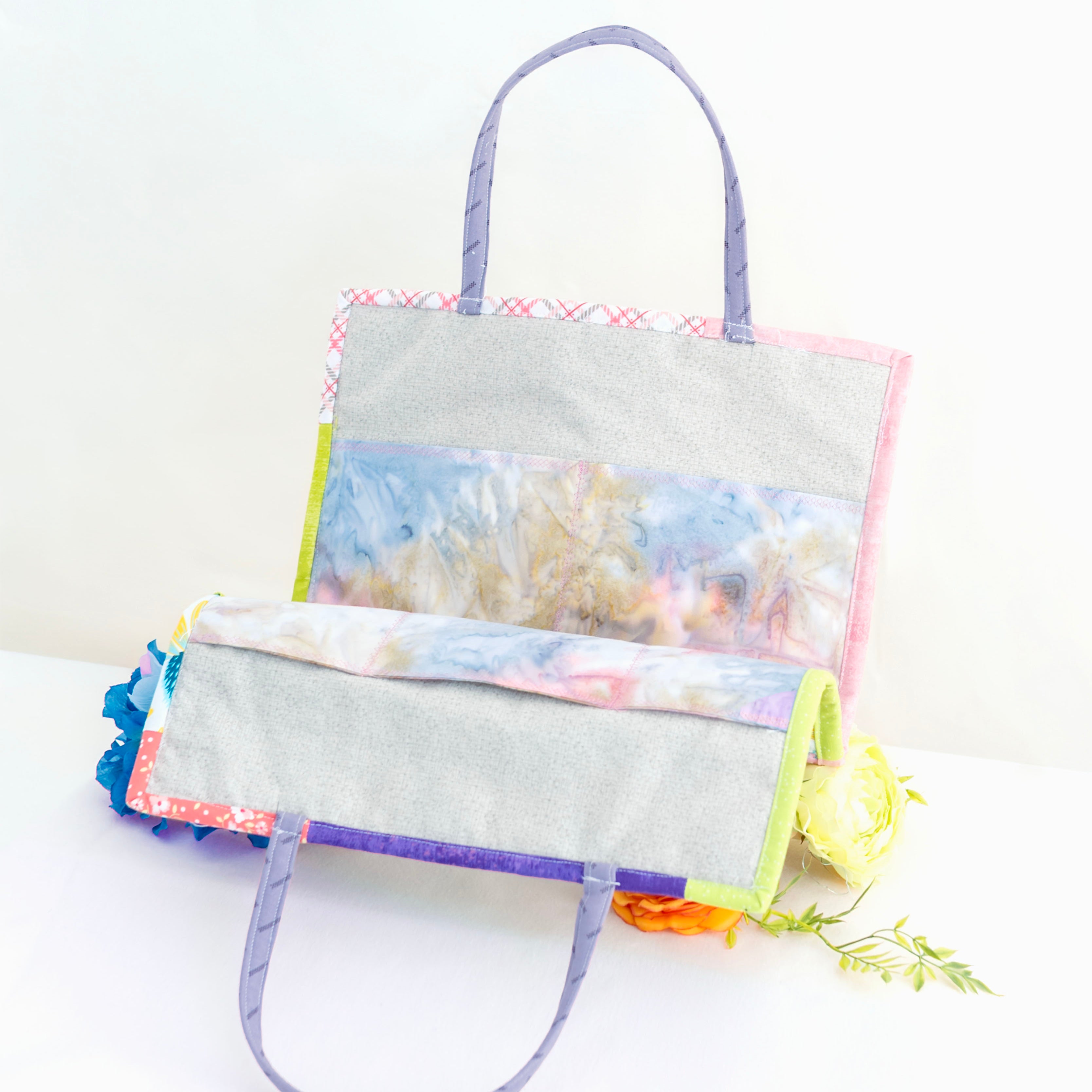 Colorful tote bag with coral reef design on a white background