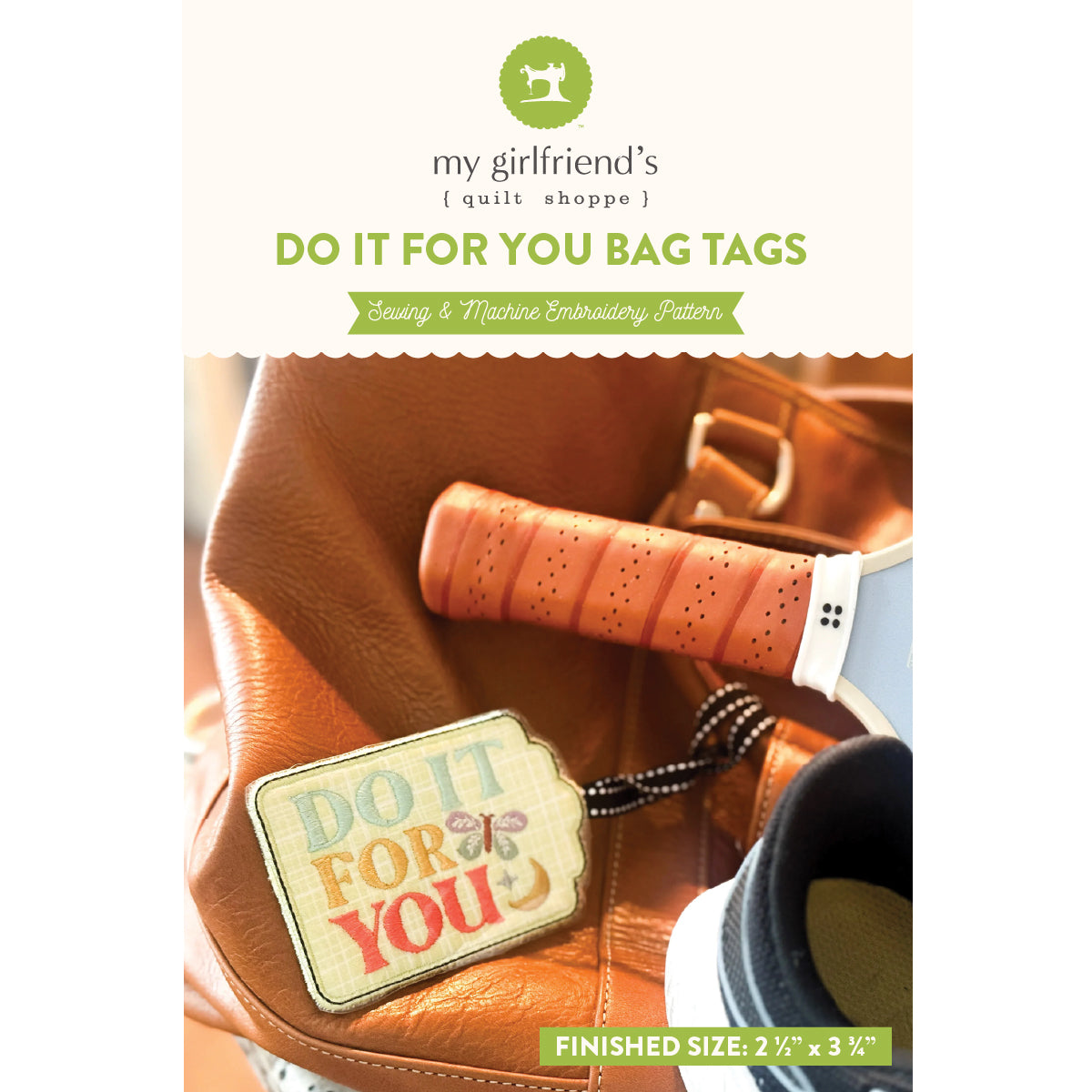 Bag tag with 'Do It For You' text on a leather bag, featuring 'my girlfriend's quilt shoppe' branding.
