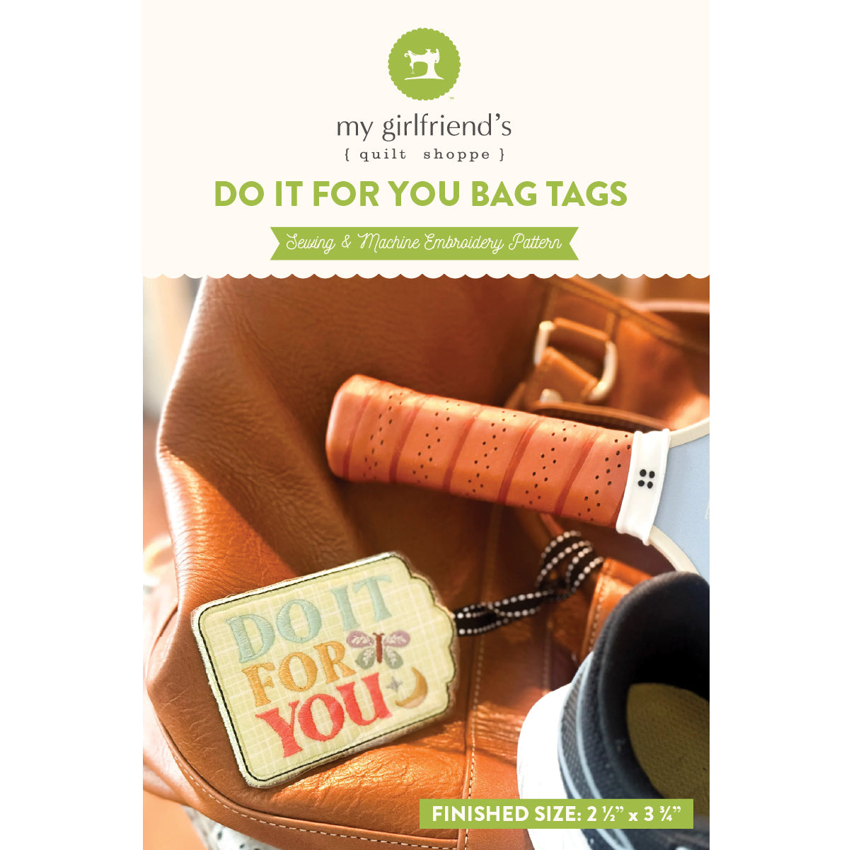 Bag tag with 'Do It For You' text on a leather bag, featuring 'my girlfriend's quilt shoppe' branding.