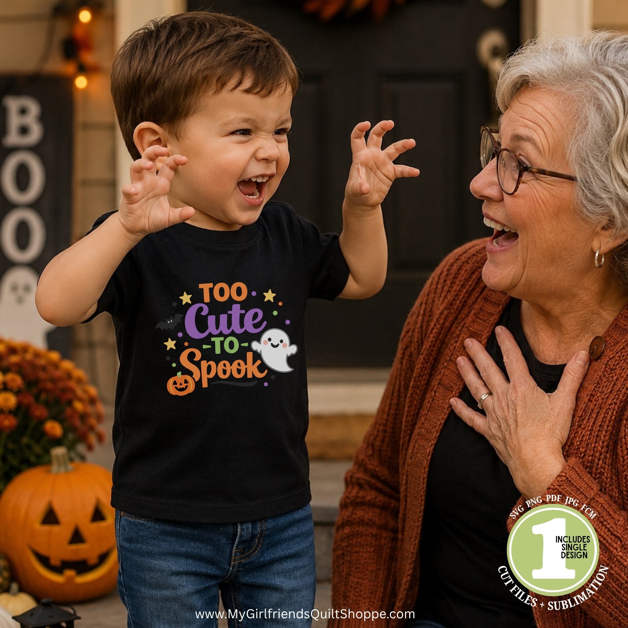 A young boy wearing a black graphic t-shirt that reads 'Too Cute to Spook' in purple, orange, and white, standing next to an older woman in a cozy outdoor setting with pumpkins and fall decorations.