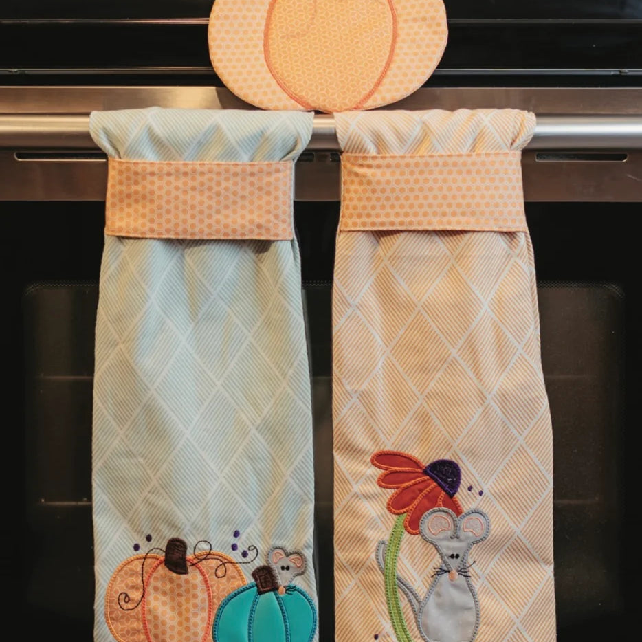 Harvest Mouse Tea Towels hanging on oven door.