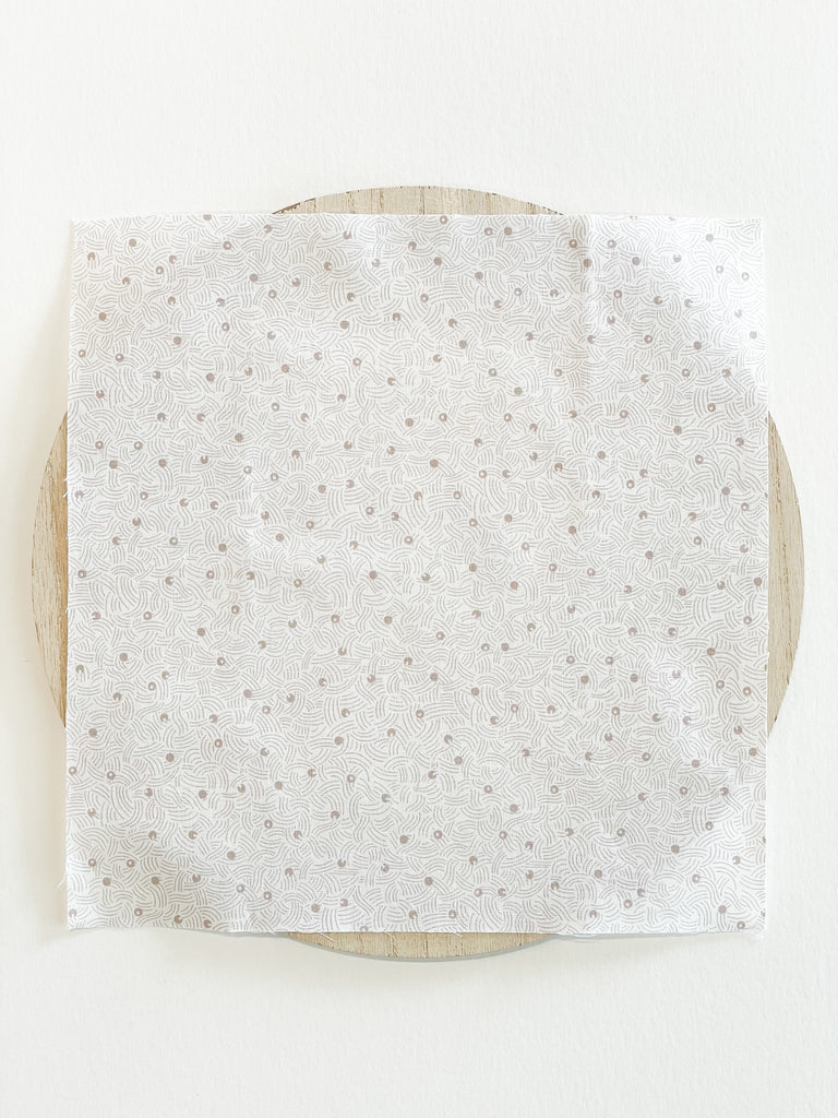 elements, white fabric with tiny, dark swirls and dots