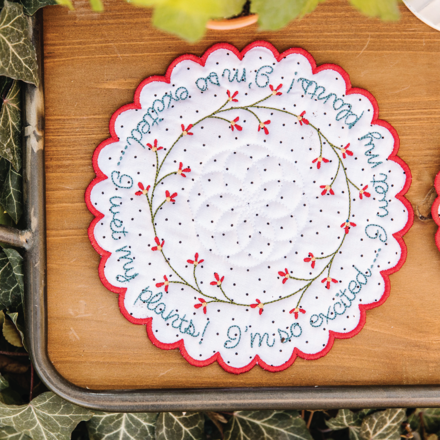 Decorative doily with floral embroidery on a wooden surface