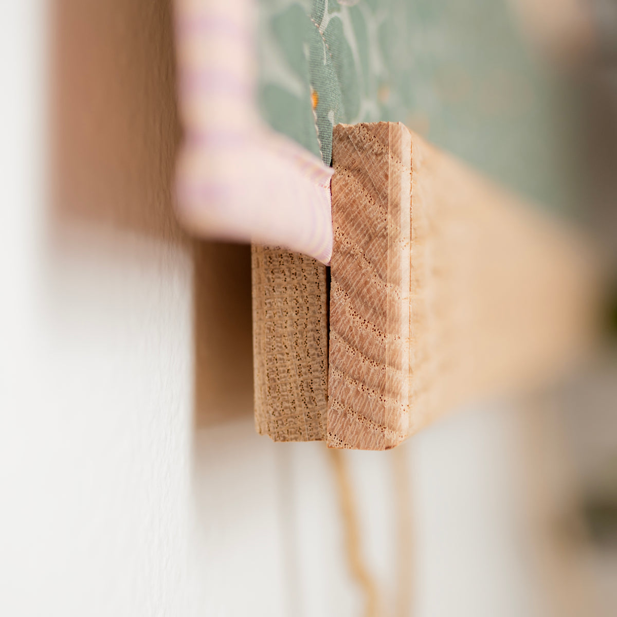 Close-up of a wooden block with a blurred background 36" wall hanger