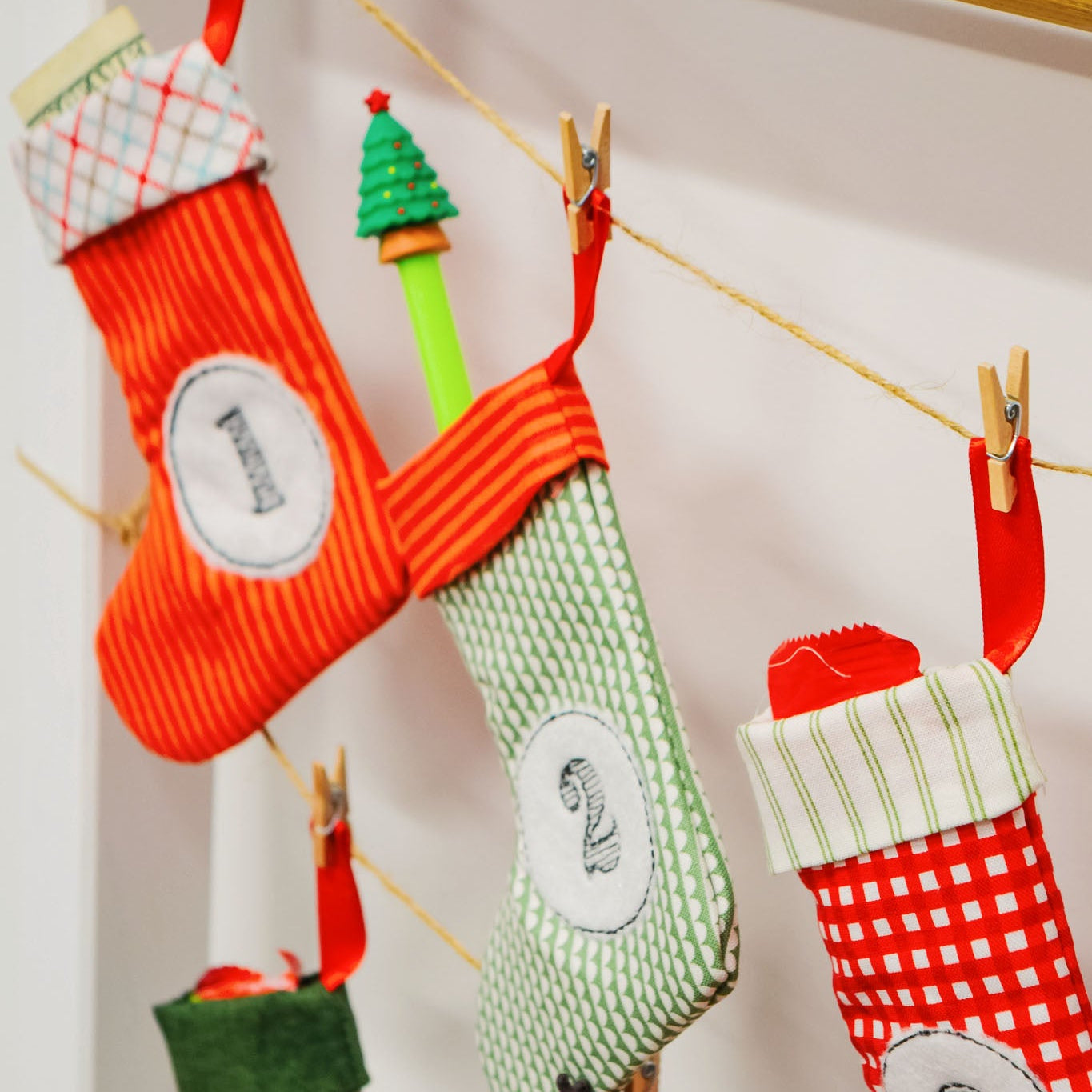 Decorative stockings with numbers hanging on a line