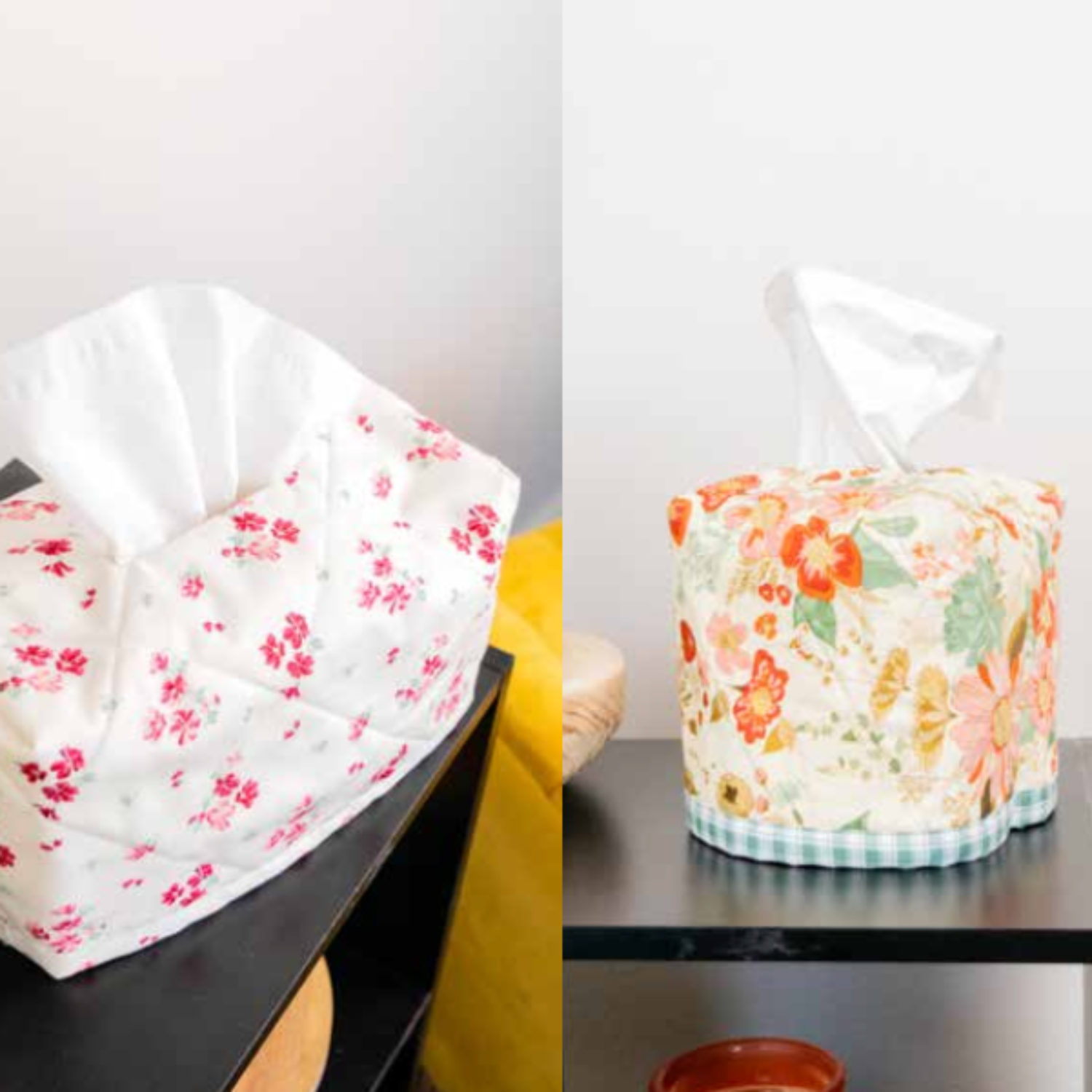 Two floral-patterned tissue boxes on a black surface with a white background