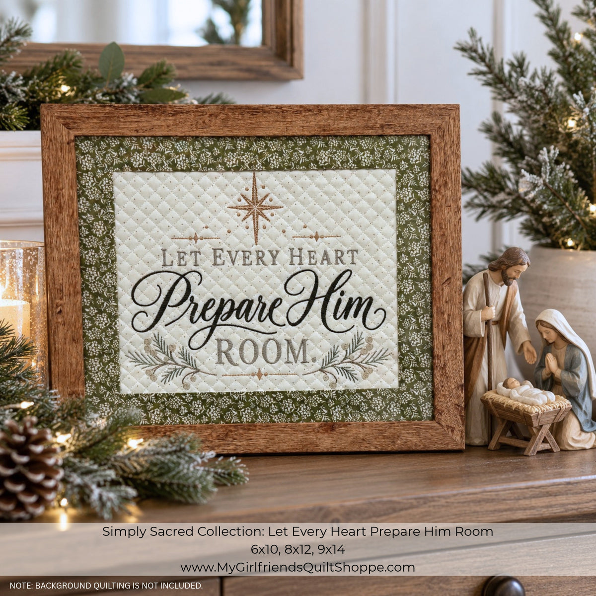 A framed decorative sign reading “Let Every Heart Prepare Him Room” displayed on a shelf with holiday greenery, candles, and a small nativity figurine. The sign has a quilted cream center, a green patterned border, and a rustic brown wood frame.