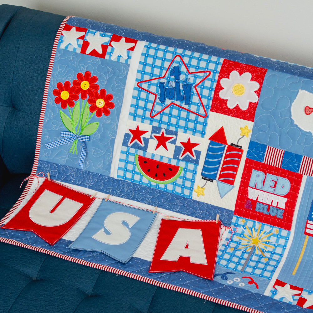Children's quilt with patriotic designs on a blue couch