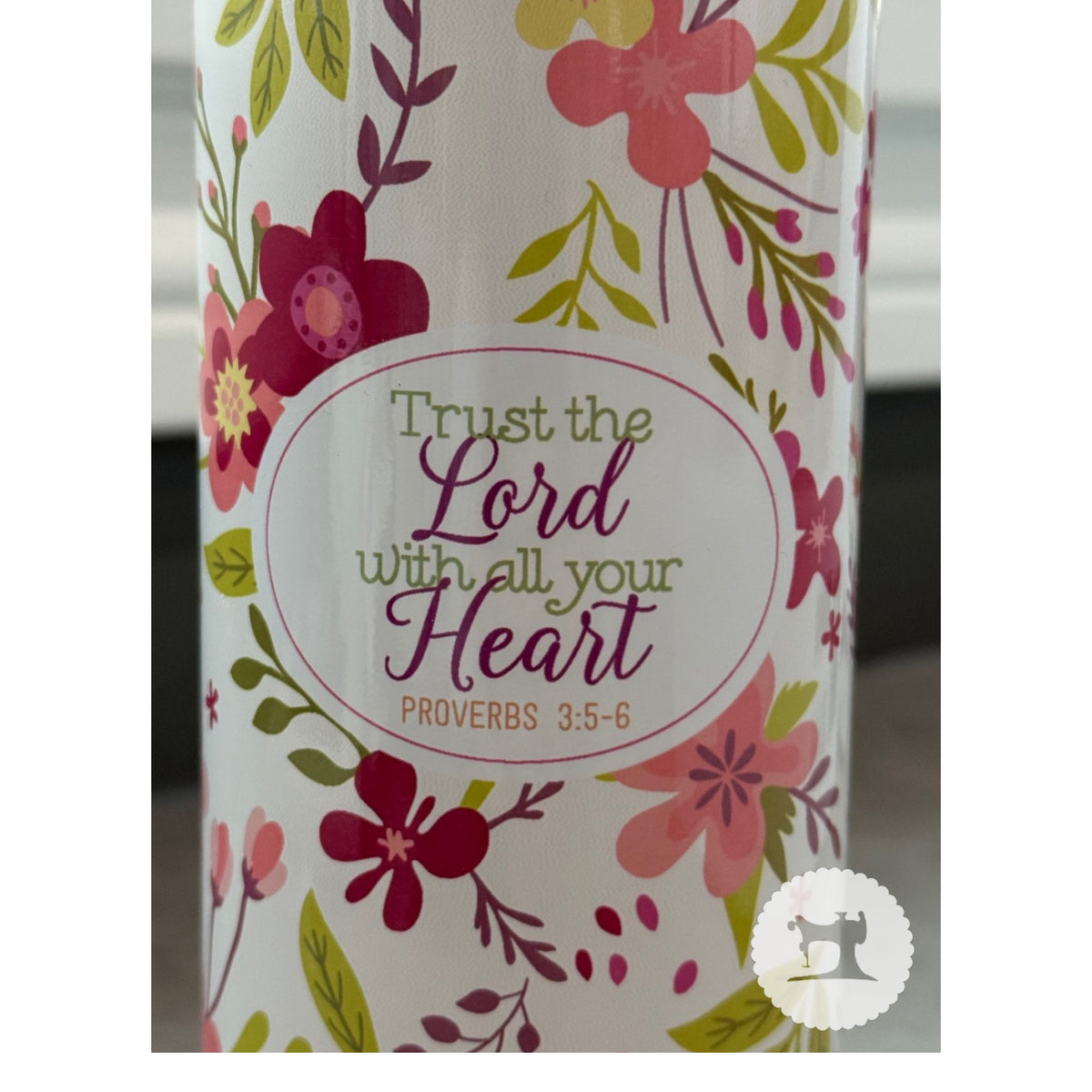 Floral-patterned product with 'Trust the Lord with all your heart' text on a white background