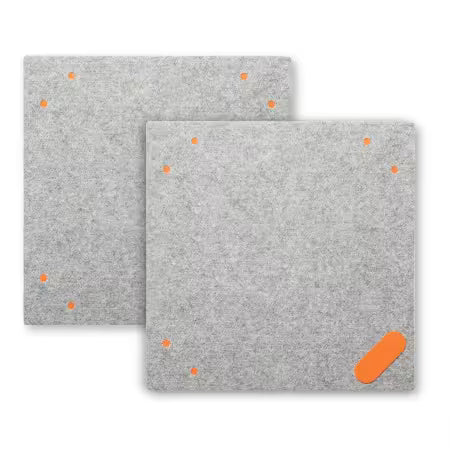 Two square gray WOOL pads with small orange dots and an orange oval accent, shown on a white background.