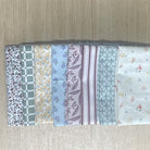 Set of fabric swatches with various patterns on a wooden surface