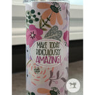 Tumbler with floral design and motivational quote on a white background