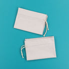 Two white cinche sacks from Kimberbell