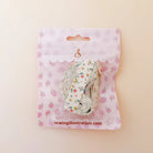 A roll of floral washi tape in a clear plastic bag with a pink strawberry-patterned backing card, displayed on a light beige background.