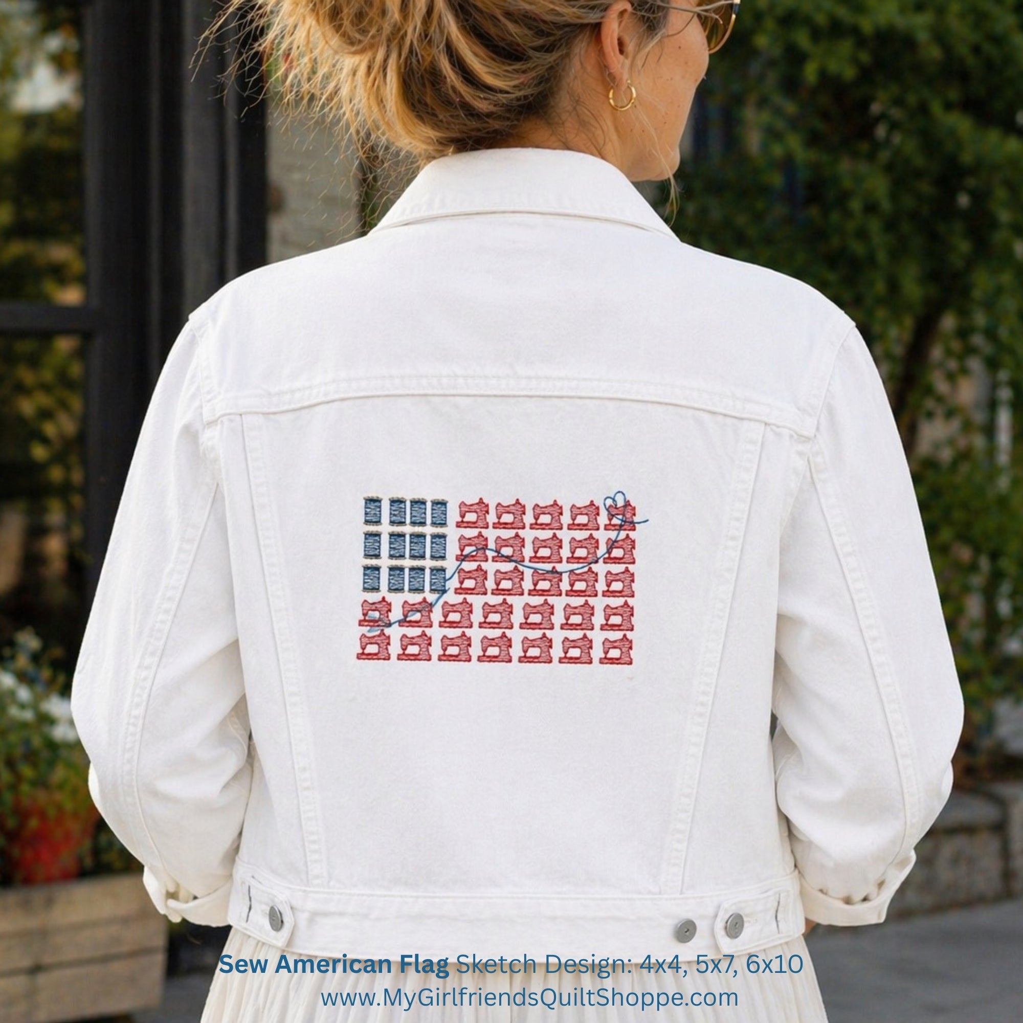 White denim jacket with American flag design on the back, worn by a person outdoors.