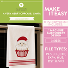 A promotional graphic for a downloadable embroidery design showing a white kitchen towel with a Santa cupcake motif hanging on an oven handle. The left side includes a green header reading 'my girlfriend's quilt shop' and 'A VERY MERRY CUPCAKE: SANTA,' and the right side is pink with text saying 'MAKE IT EASY' and listing file types and included sizes.
