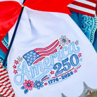 Embroidered apron with 'America 250' design on a decorative background