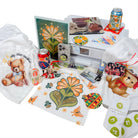 Collection of printed materials with teddy bears and floral designs on a white background made by Artspira Powered Sublimation Printer