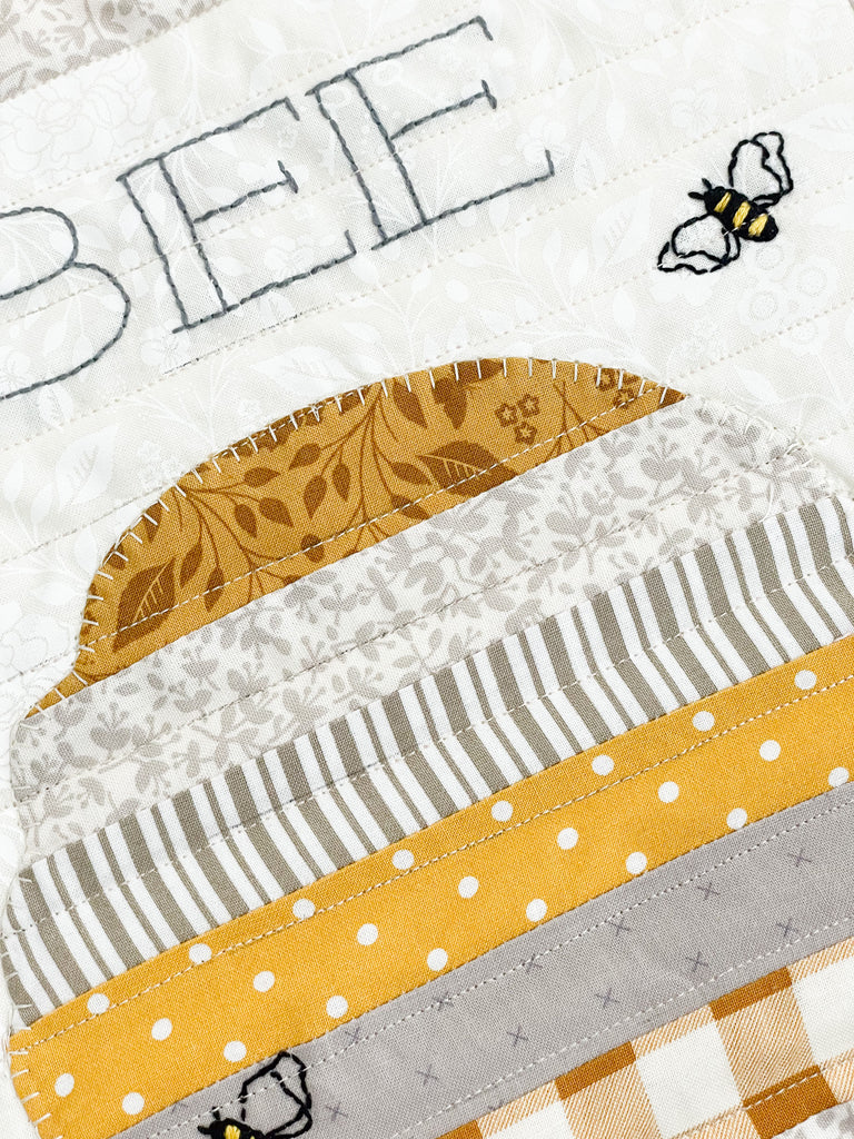 Close up of the Bee Creative pillow 