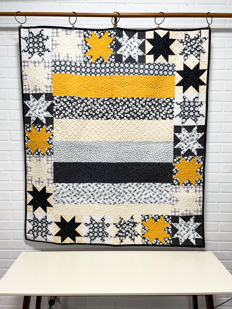 black and yellow quilt