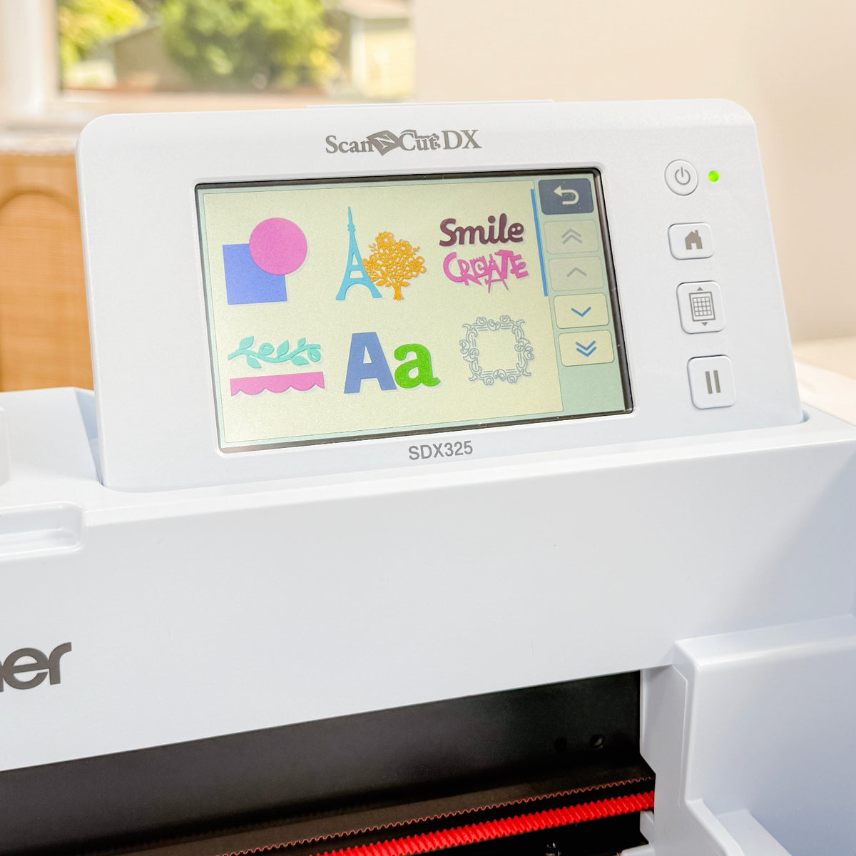 Cricut cutting machine with digital display in a bright room