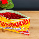 Stamper's Jellybeans candy pouch on a wooden surface with a blurred background