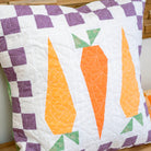 Quilt with carrot pattern on a wooden surface