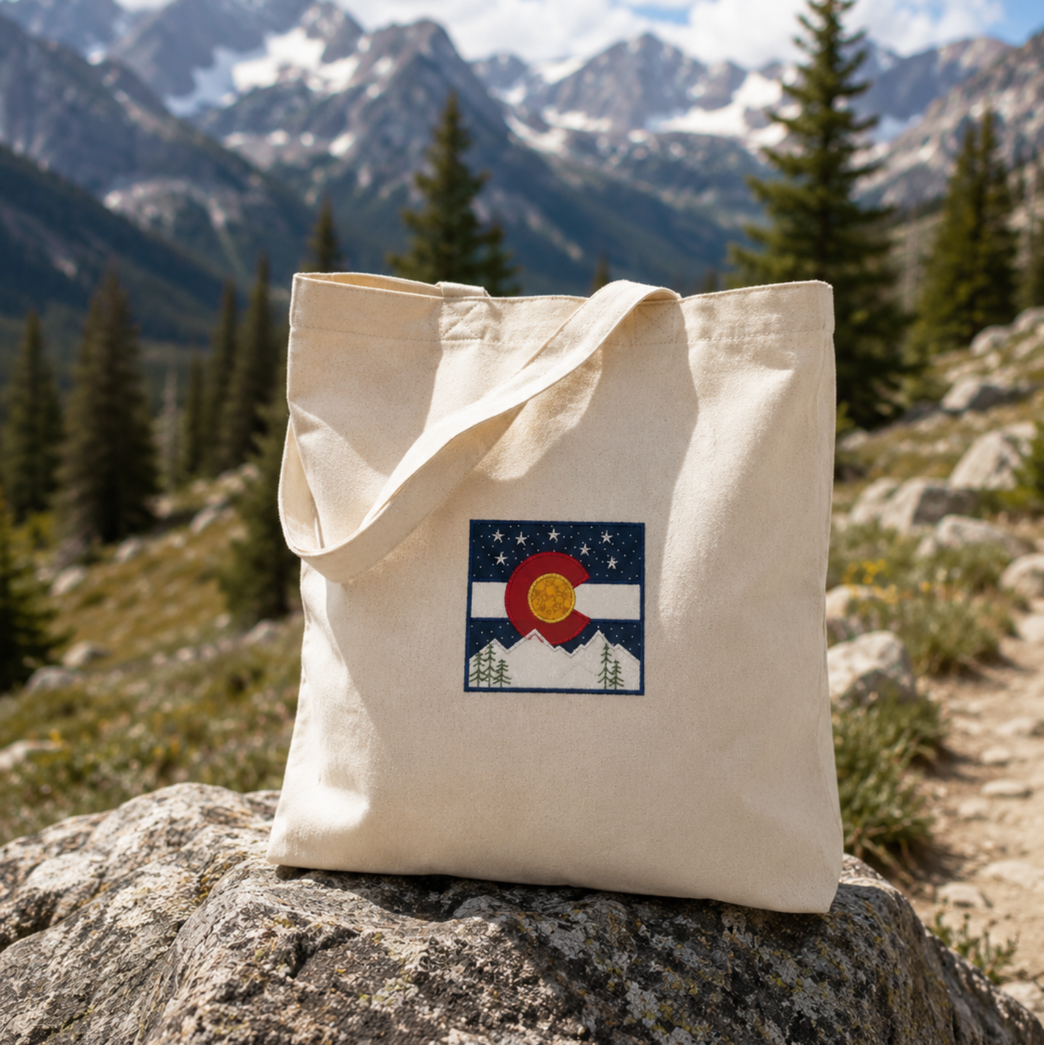 Keychain with Colorado flag design on a wooden surface