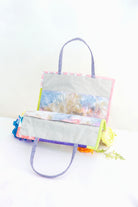 Colorful tote bag with coral reef design on a white background