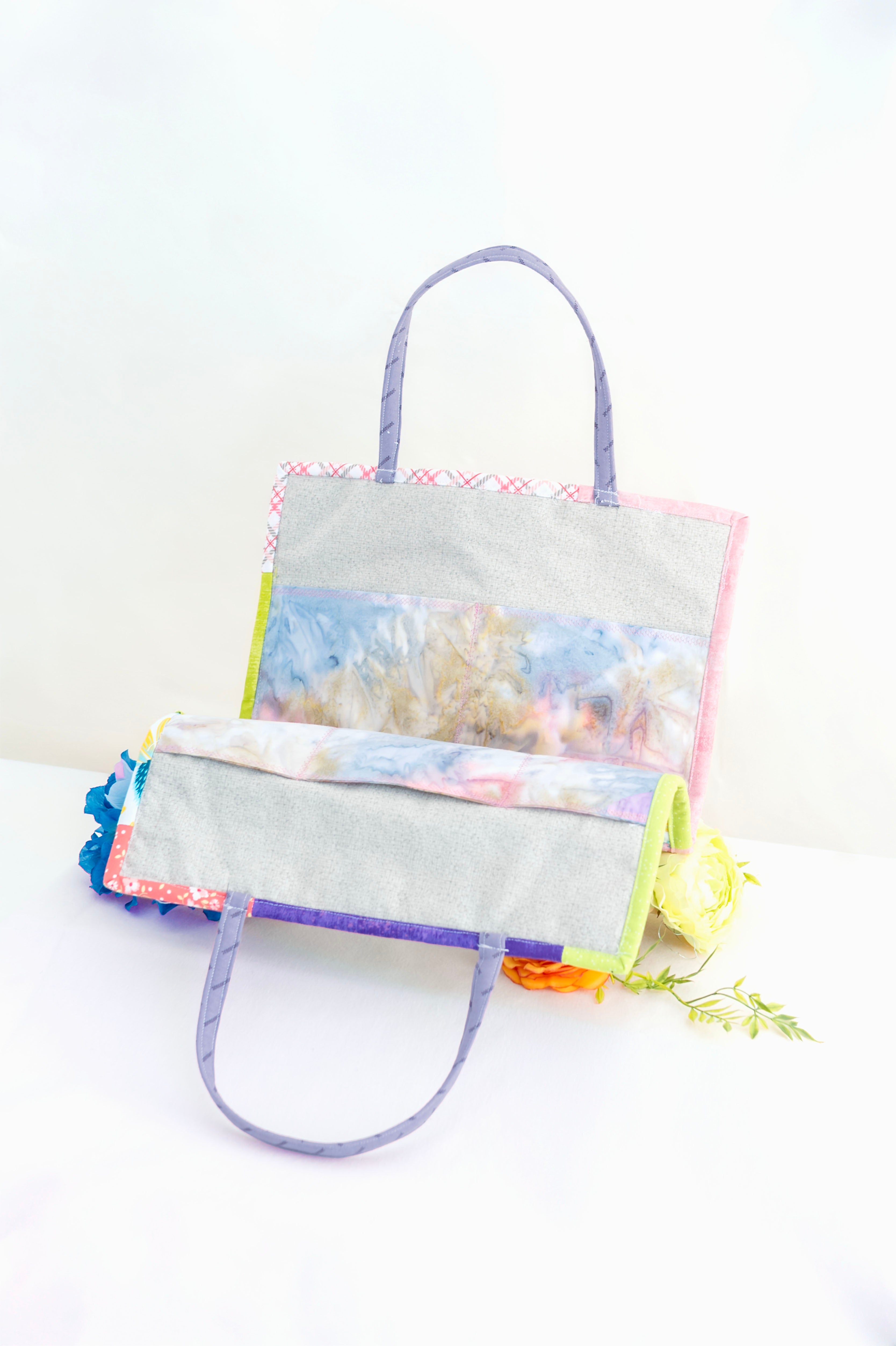 Colorful tote bag with coral reef design on a white background