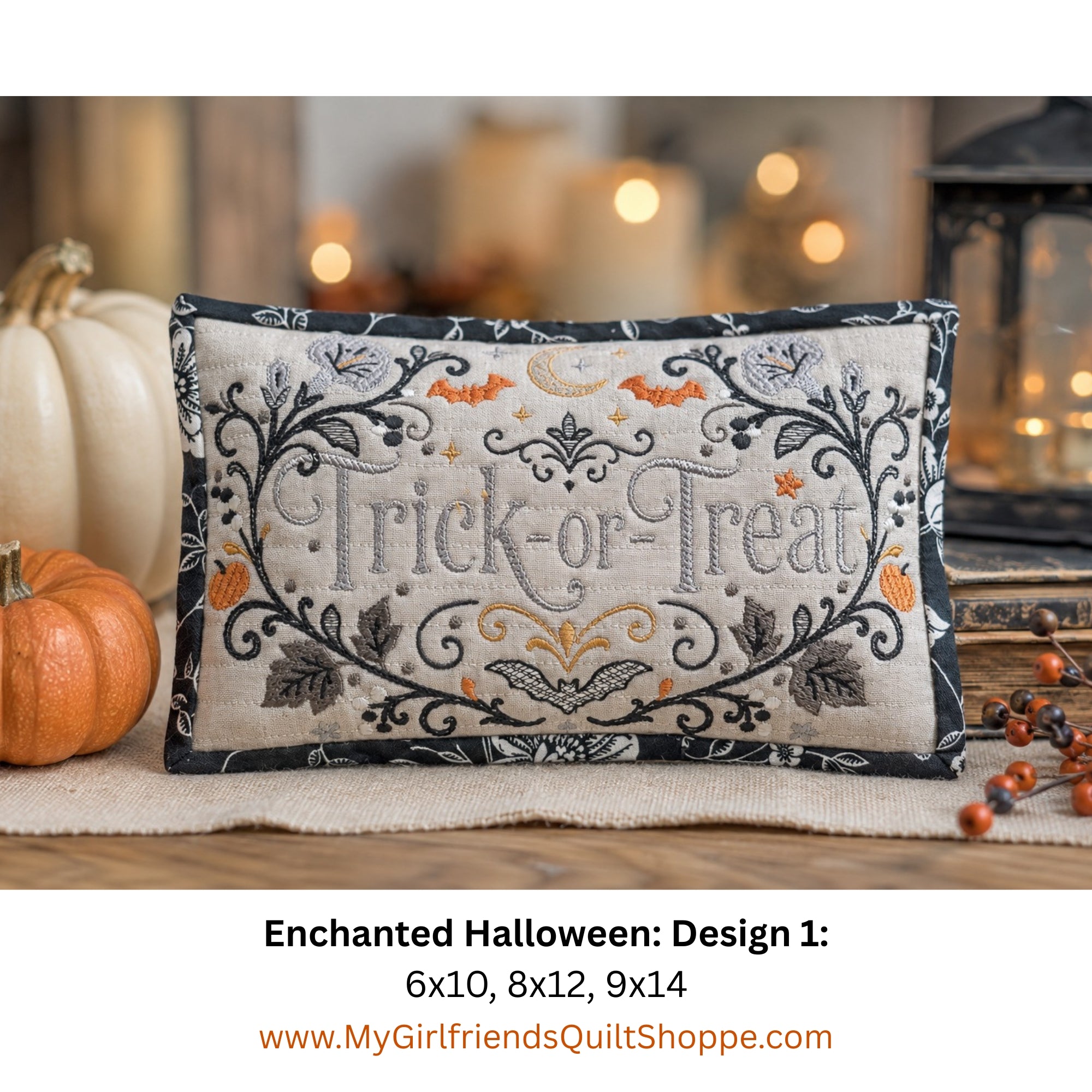 A rectangular embroidered decorative pillow with a Halloween 'Trick or Treat' design, styled on a table with pumpkins and warm bokeh lights in the background. Text below reads 'Enchanted Halloween: Design 1: 6x10, 8x12, 9x14' with the website 'www.