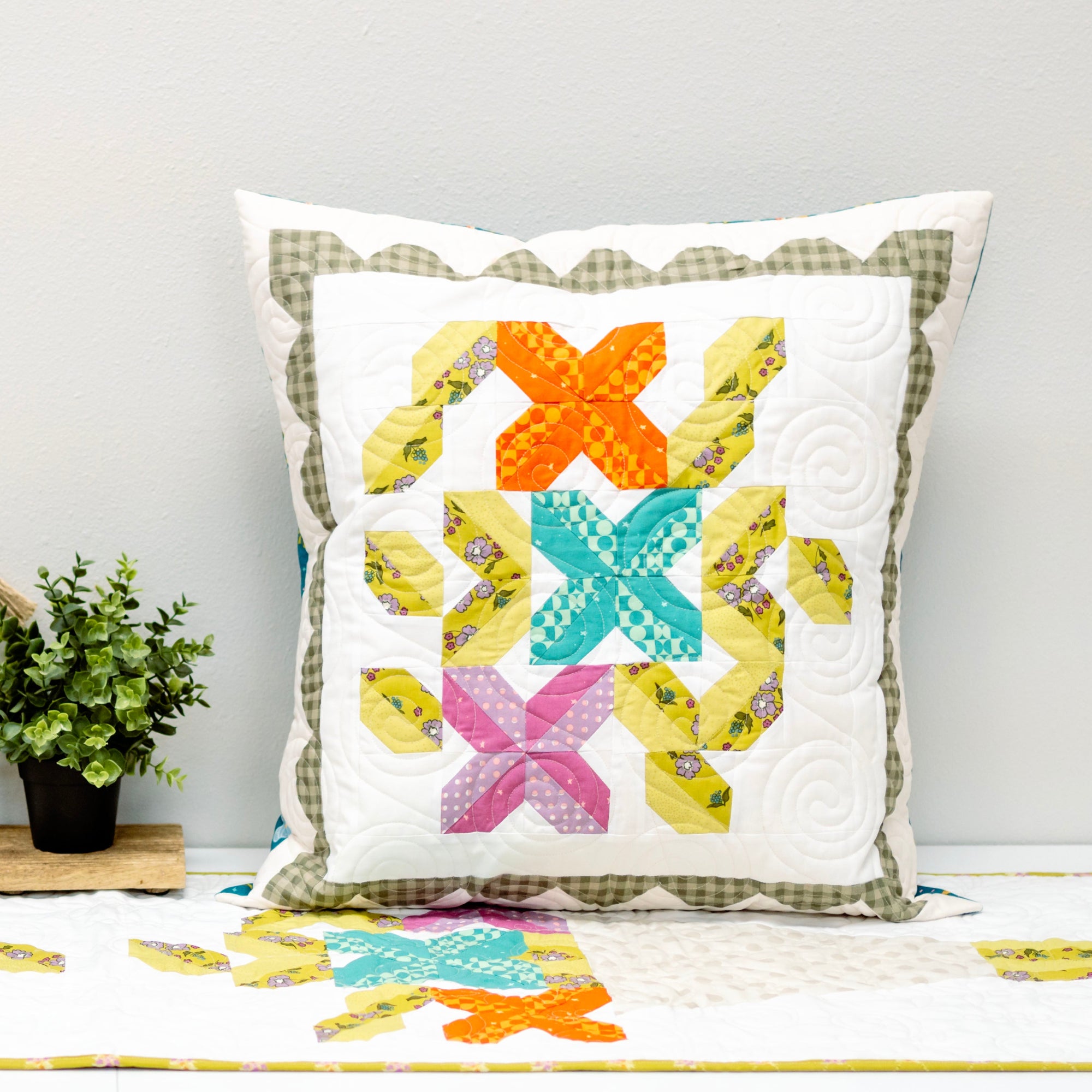 Decorative pillow with colorful butterfly pattern on a white background