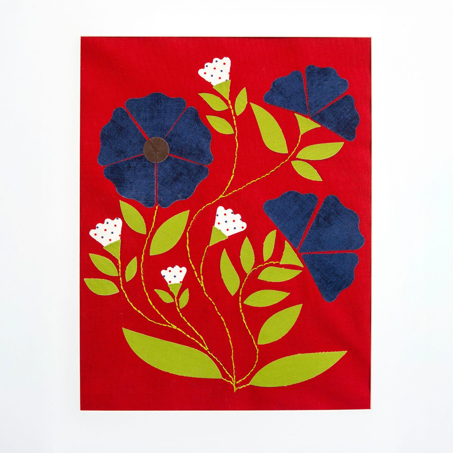 Floral design with blue flowers, green leaves, and white flowers on a red background