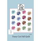 Pattern cover for the 'Fussy Cut Fall Quilt' by Jon Bellamy Design, featuring a grid of colorful autumn-themed quilt blocks on a white background with a light blue border.