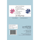 Back cover of a quilting pattern booklet for 'Fussy Cut Fall Quilt' by Jen Belnap Design, featuring fabric requirements, pattern and throw sizes, a barcode, and quilt design illustrations on a light blue background.