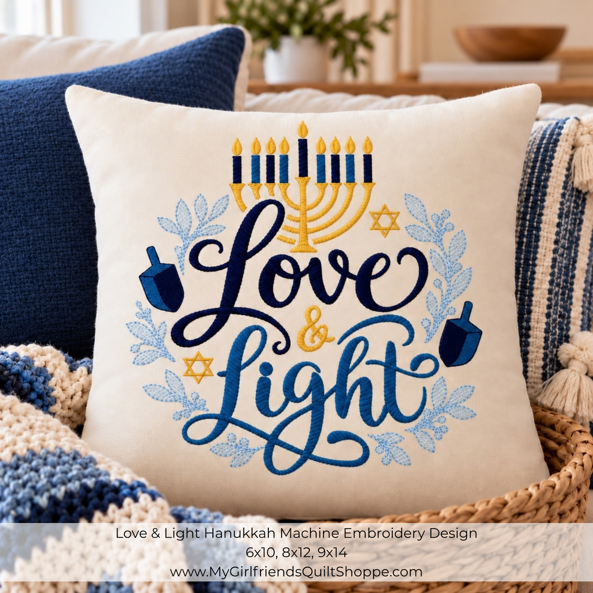 A square throw pillow shown in a cozy living-room setting, featuring a Hanukkah-themed machine embroidery design with the words “Love & Light” in dark blue script, a gold menorah, blue dreidels, blue floral accents, and gold Star of David motifs. Text at the bottom reads “Love & Light Hanukkah Machine Embroidery Design 6x10, 8x12, 9x14” and includes the website MyGirlfriendsQuiltShoppe.
