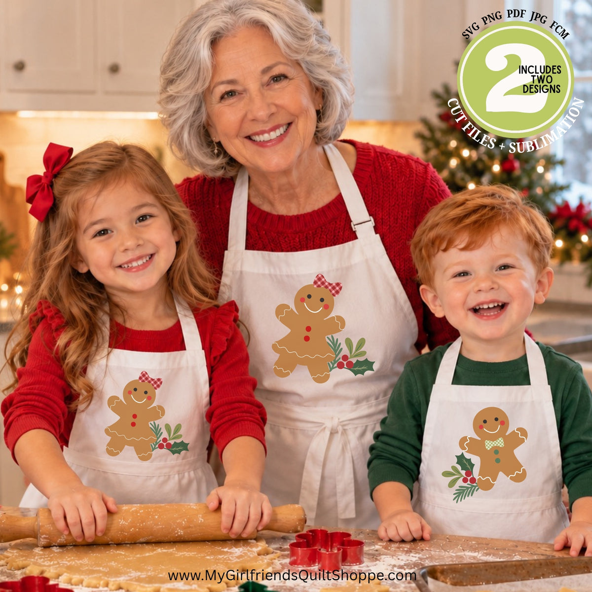 Three people in a kitchen wearing matching white aprons with gingerbread cookie designs, rolling out dough on a floured surface. A holiday tree is blurred in the background, and a green circular badge says the file includes two designs.