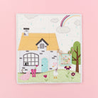 Children's puzzle with a house, rainbow, and animals on a pink background