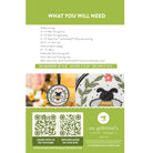 Embroidery kit packaging with QR code and branding information.