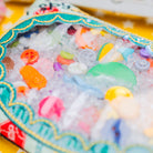 Children's toy with colorful beads and toys on a yellow background with stars