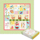 Colorful quilt with patchwork design featuring nature and picnic elements, displayed on a green polka dot background.
