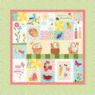 Colorful patchwork quilt with various patterns and illustrations on a green polka dot background.