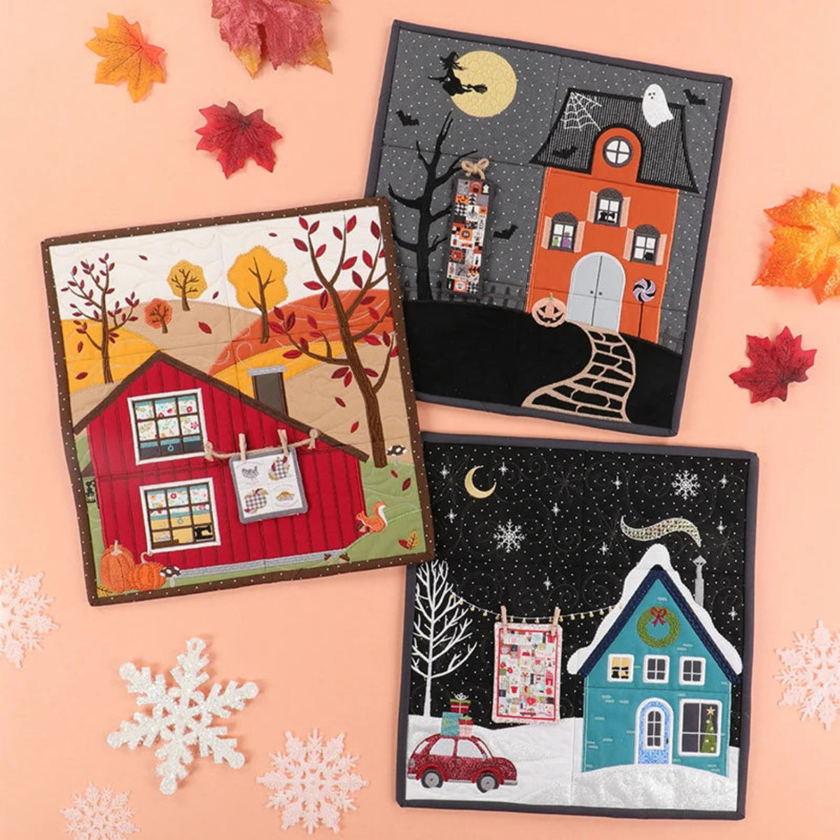 Three seasonal-themed fabric panels on a pink background with autumn and winter elements.