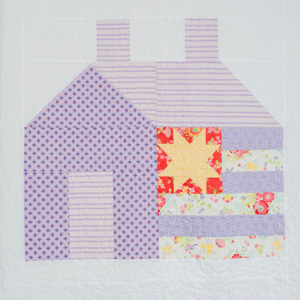 Patchwork house design on a floral background