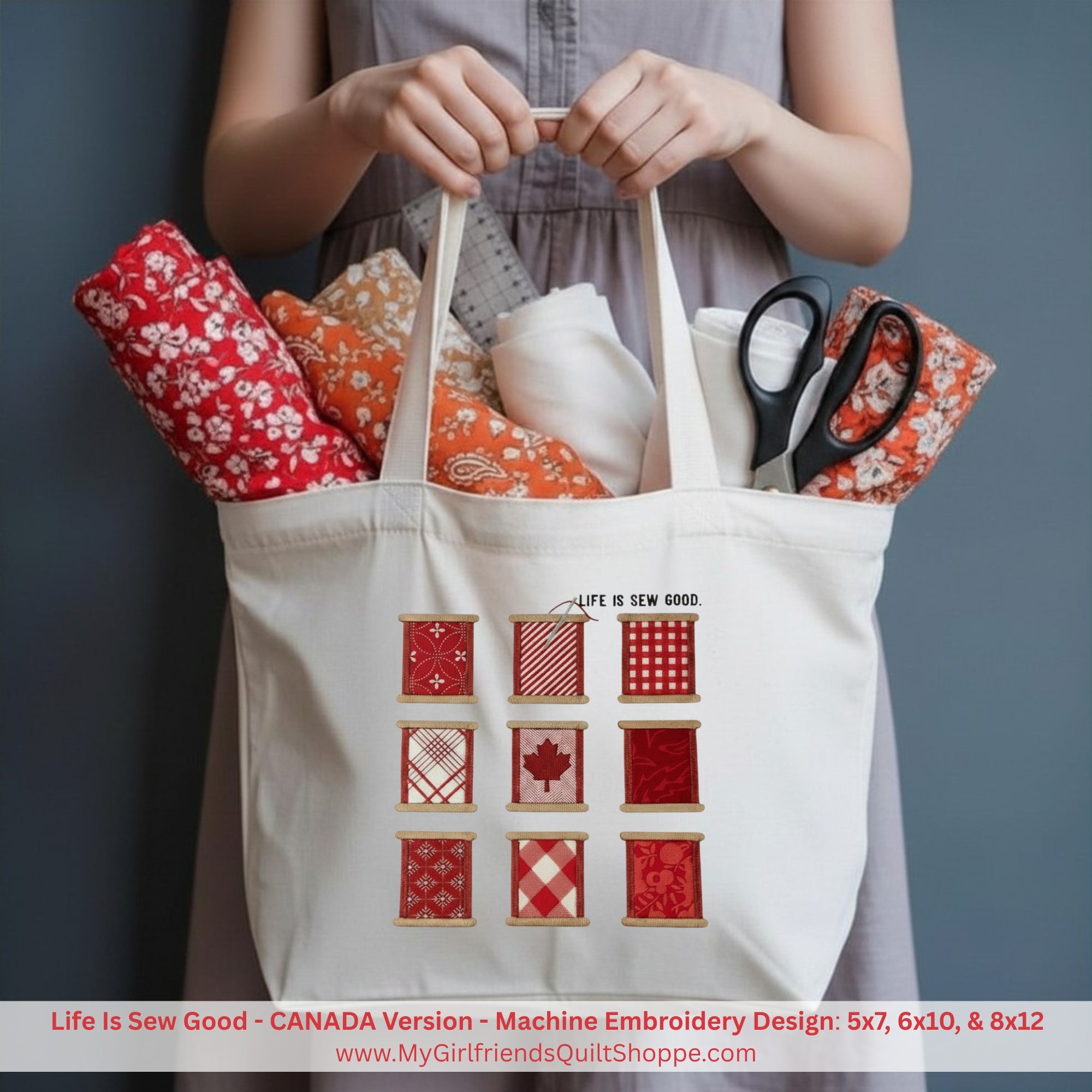 Person holding a tote bag with fabric and scissors, featuring 'Life Is Sew Good' design.