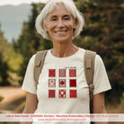 Woman wearing a 'Life Is Sew Good' t-shirt with a quilt design, standing outdoors.