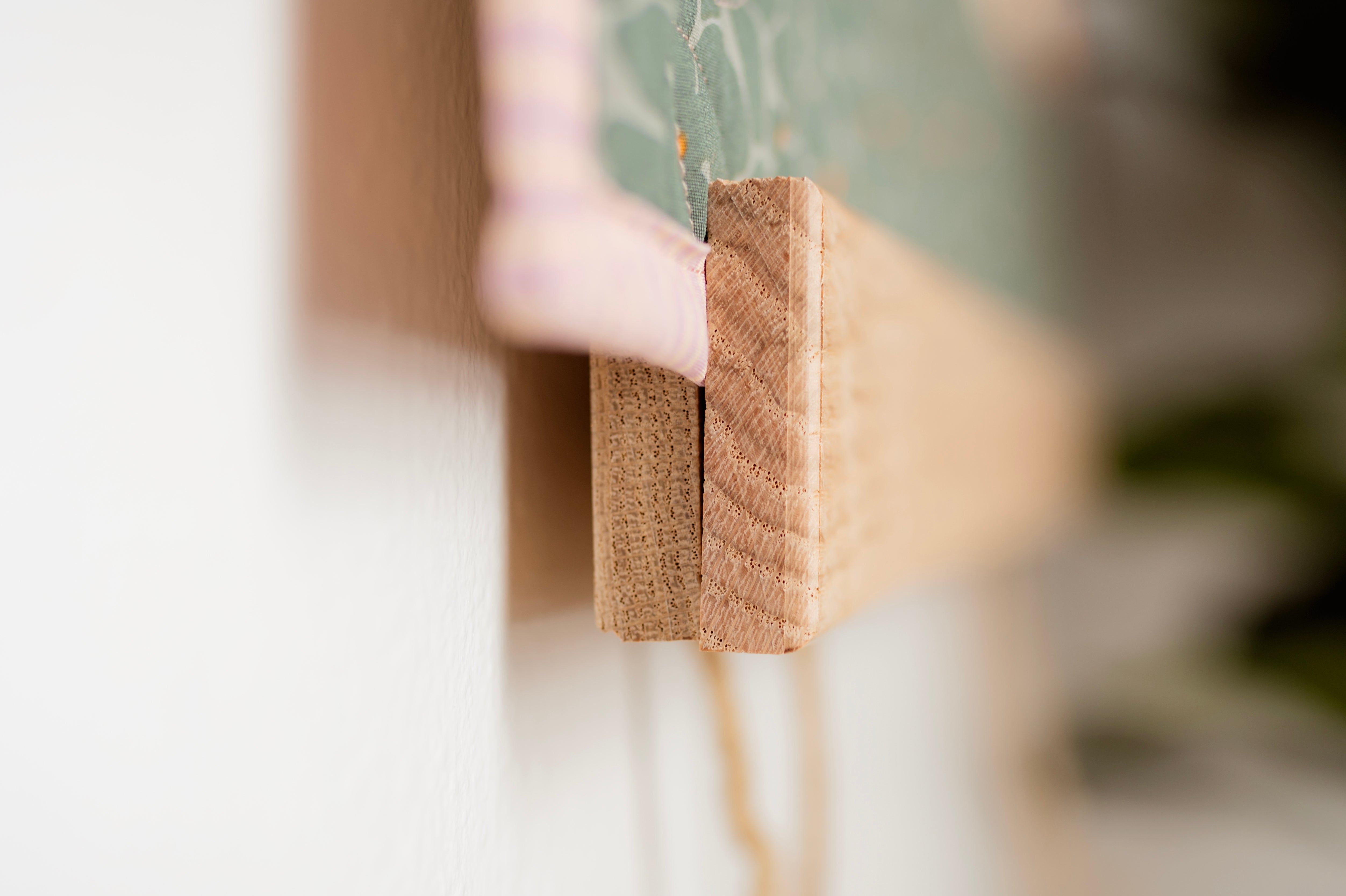 Close-up of a wooden block with a blurred background 36" wall hanger