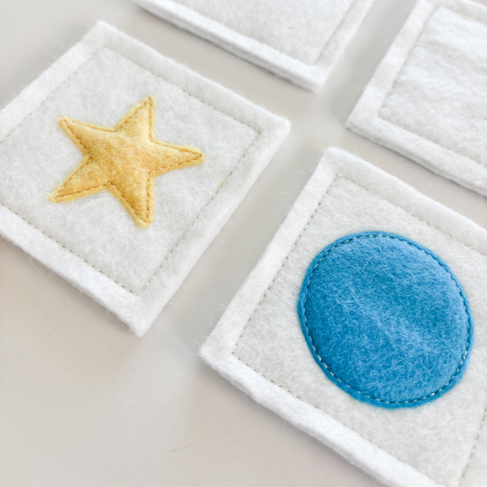 Felt patches with star and circle designs on a light background